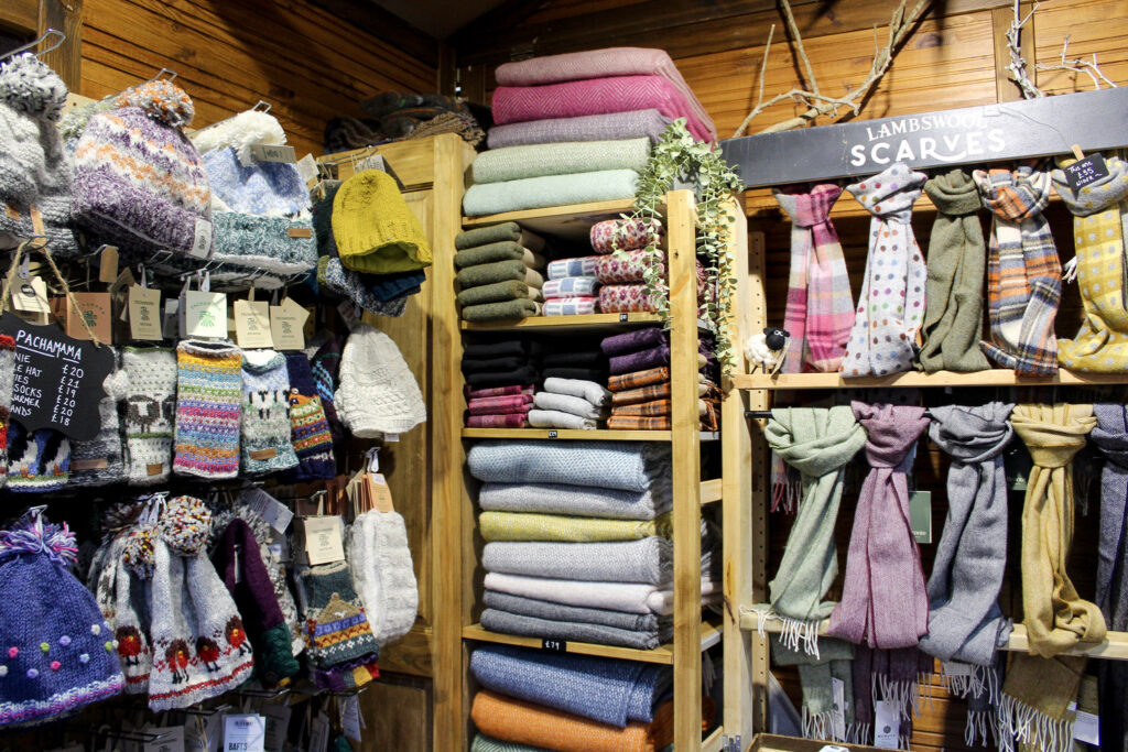 A stallholder selling woollen knitwear