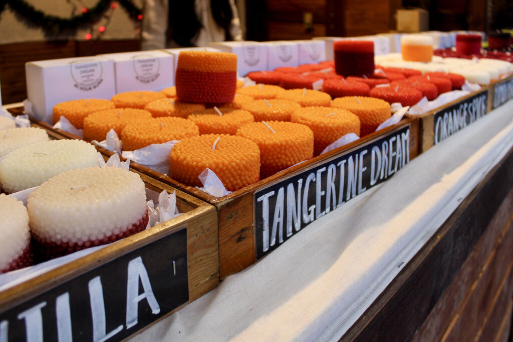 A stallholder selling candles