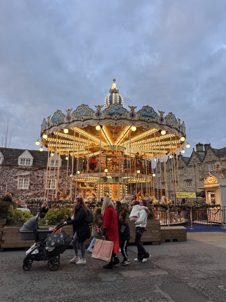 Christmas carousel with lights on at dusk